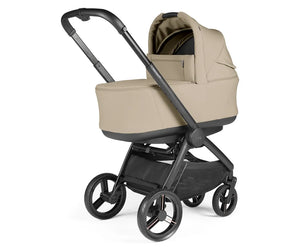 Beige and black peg perego city loop pro 3 in 1 elite travel system stroller with soft fabric carrycot in vanilla blend