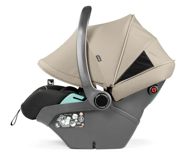 Beige and gray infant car seat with mesh panel on canopy in peg perego city loop pro 3 in 1 elite travel system vanilla blend