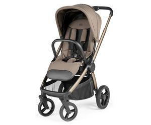 Beige and black peg perego city loop pro stroller with sleek metallic frame soft fabric seat and sturdy wheels