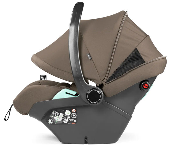 Brown fabric-lined peg perego city loop pro infant car seat with black frame and mint green accent in pine bark bundle
