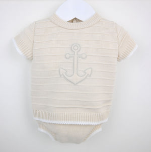 Cream-colored knitted baby onesie with subtle anchor embroidery in beige and white anchor baby boys knit outfit set
