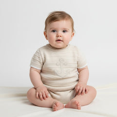 Beige and white anchor baby boys knit outfit with soft cream cream knitted onesie and subtle anchor design on chest