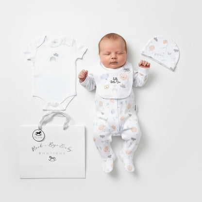 White unisex baby onesie with soft subtle animal print and gentle ruffled neckline from little one layette set