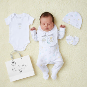 White baby onesie with subtle pastel cloud and star print from unisex welcome 5 piece layette set