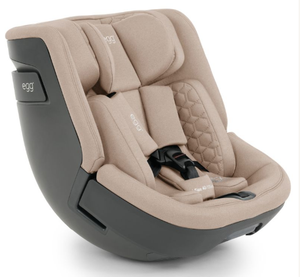 Beige and black Egg toddler 360 convertible car seat with quilted fabric upholstery for safe comfortable travel