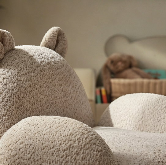 Beige plush bear-shaped kids chair with soft textured boucle fabric and rounded ears in mushroom color