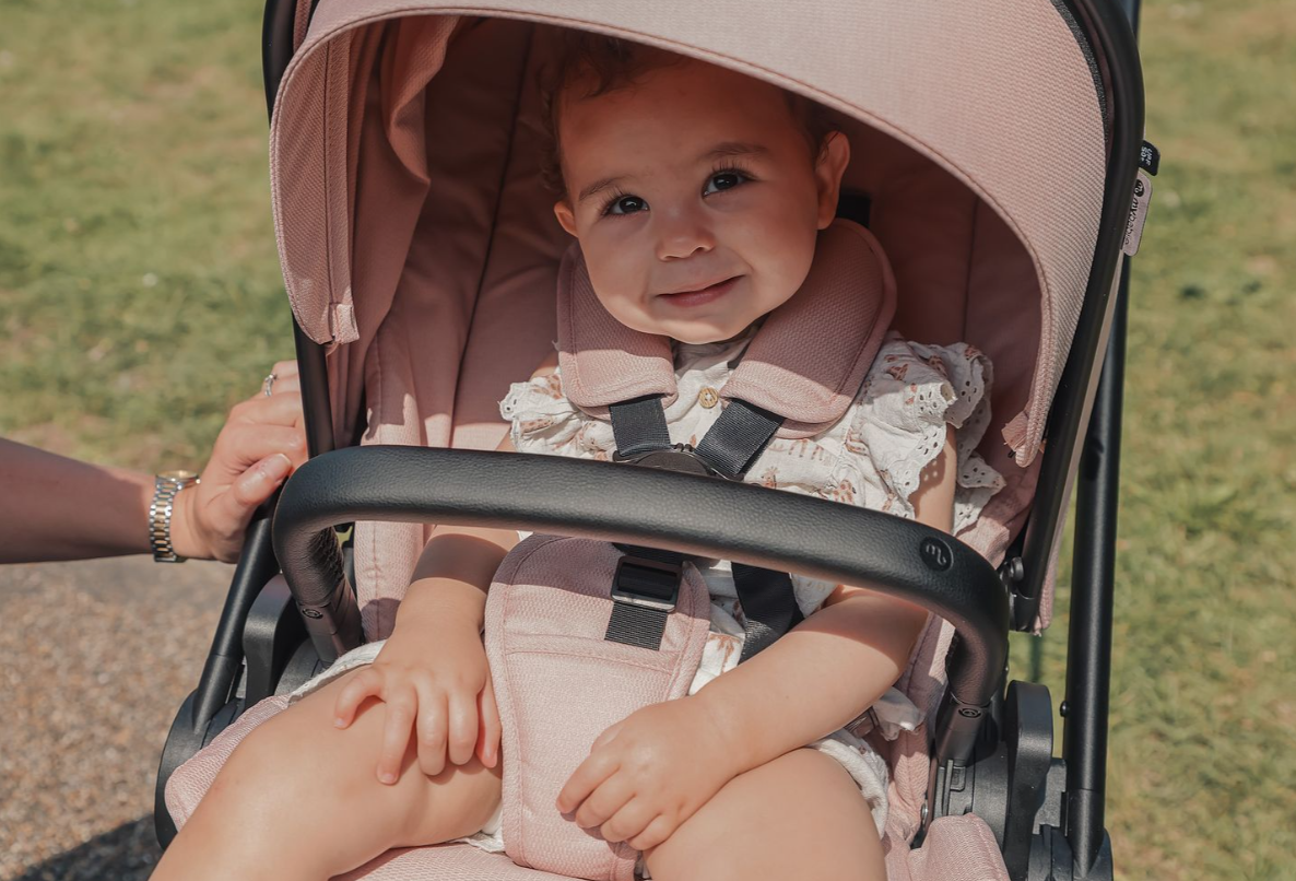 My Babiie MB450 forward and rear facing pushchair in pink with black frame and handlebars for versatile use