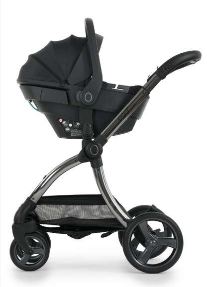 Black infant car seat with a sleek modern design and metallic silver frame from egg3 carbonite luxury bundle