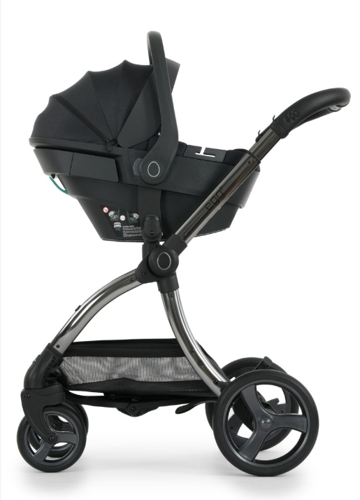 Black infant car seat with sleek modern design and metallic silver frame in egg3 carbonite all stages 360 bundle