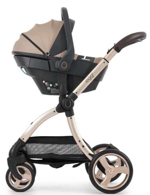 Beige and black egg3 feather stroller with sleek metallic frame soft fabric canopy and stylish wheels with shell 360 car seat