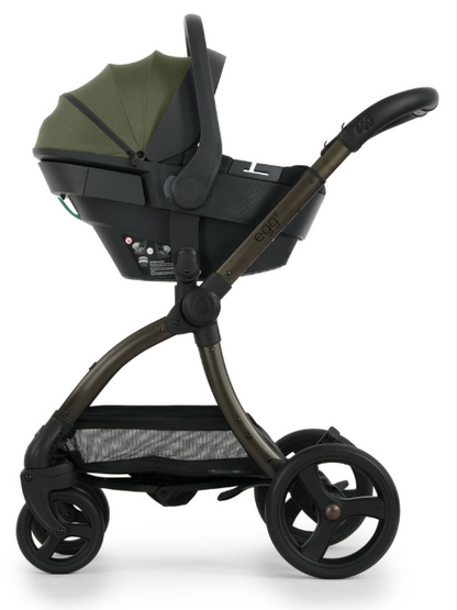 Black and olive green egg stroller with fabric canopy and metal frame in egg3 sage luxury bundle with car seat