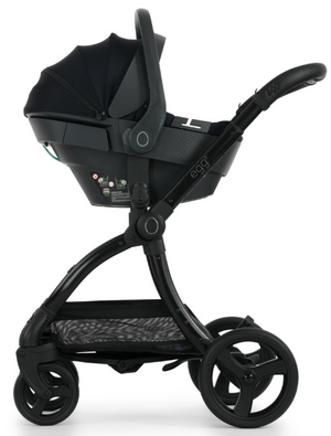 Black egg3 panther stroller with sleek modern design paired with shell 360 i-size infant car seat and 360 isofix base