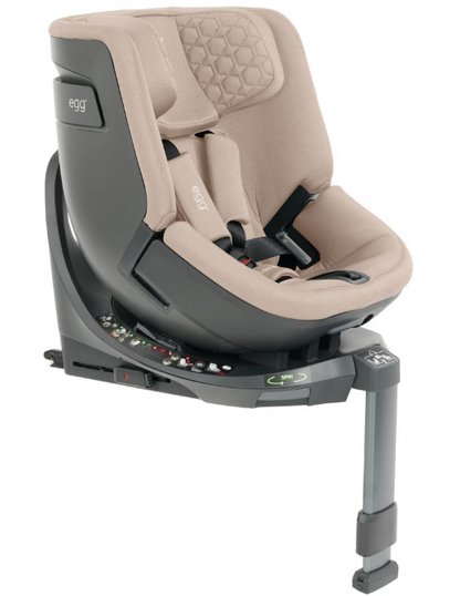 Beige and black egg toddler 360 convertible car seat with quilted fabric upholstery for safe travel