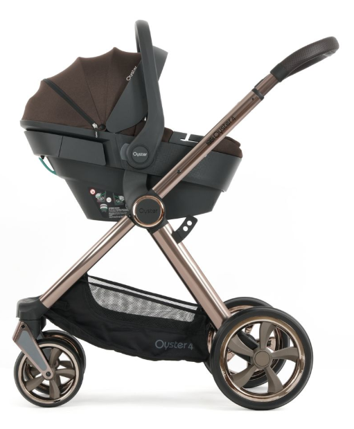 The oyster 4 stroller in chocolate velvet essentials travel system features a rose gold metallic frame with black accents