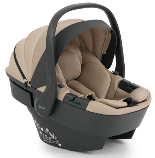 Beige and black oyster infant car seat with soft fabric interior and sleek modern design in oyster 4 fawn travel system