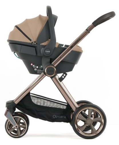 Oyster 4 fawn essentials travel system with capsule 360 car seat features a rose gold frame stroller with black seat accents