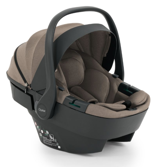 Beige and black oyster infant car seat with soft fabric interior and molded plastic frame in oyster 4 mink travel system