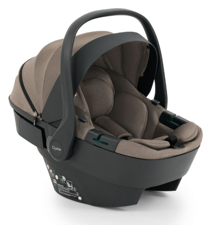 Beige and black oyster infant car seat with soft fabric interior and molded plastic frame in oyster 4 mink travel system