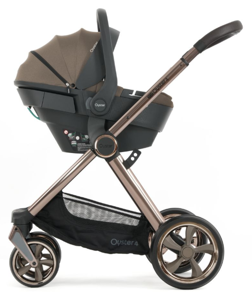 The oyster 4 mink luxury travel system features a bronze frame and black taupe canopy with embroidered logo on the side