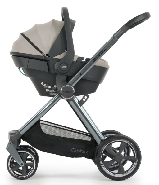 Oyster 4 stone essentials travel system featuring a modern black and gray stroller with metallic frame and adjustable handlebars