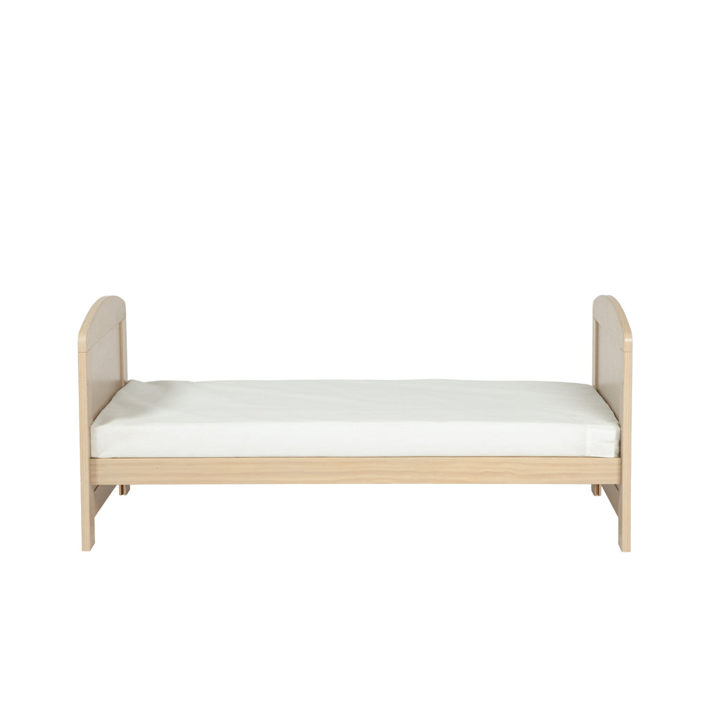 Bebe & Beyond Seeker Nordic Cot Bed converted into a toddler bed for growing children side view 
