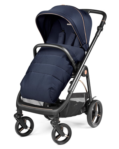 Navy blue insulated stroller with black frame and rose gold accents from peg perego veloce deluxe travel system i-size 360 spin bundle