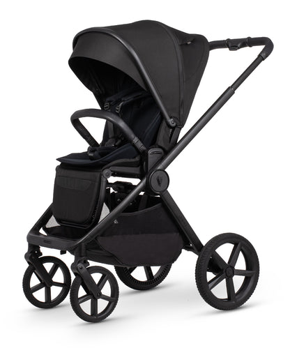 Black venicci upline 3 stroller with sleek matte finish featuring a modern design in onyx color shown from the back