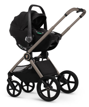 Black infant car seat with sleek modern design and metallic gray frame venicci upline 3 travel system pebble