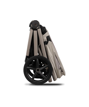 Venicci upline 3 travel system foldable stroller in pebble beige and black with a sleek design and large front wheel