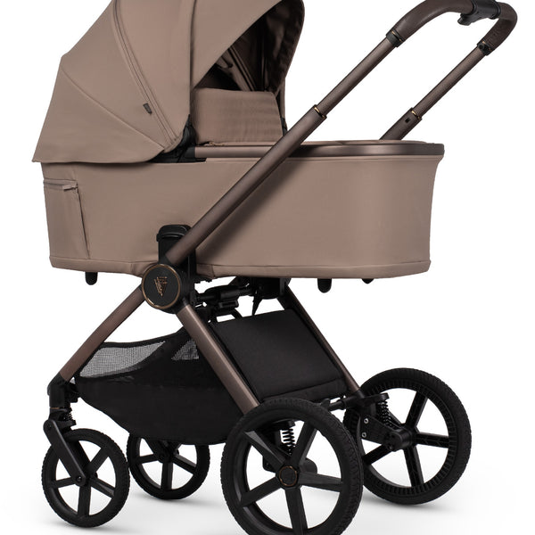 Venicci Upline 3 Travel System in sand with beige and black modern stroller, curved canopy, and sturdy metal frame
