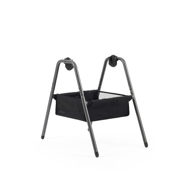 Black fabric bassinet with sleek modern metal frame babyStyle oyster carrycot stand shown from the back side