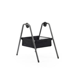 Black fabric bassinet with sleek modern metal frame babyStyle oyster carrycot stand shown from the back side