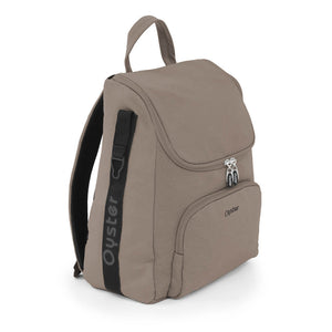 Beige oyster backpack with black strap and silver zippers from oyster 4 mink luxury travel system with rotating base