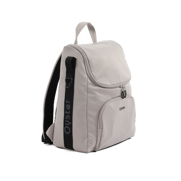 Light gray oyster backpack with black shoulder strap and logo accents from oyster 4 stone luxury travel system