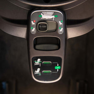 Black plastic control panel with green and white diagrams on Nuna BASE curv ISOFIX 360° rotating slide car seat base back side