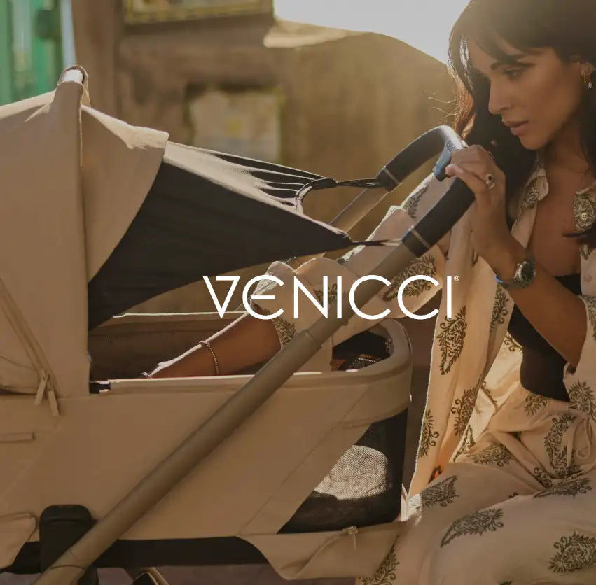 Beige and black venicci stroller with a canopy.