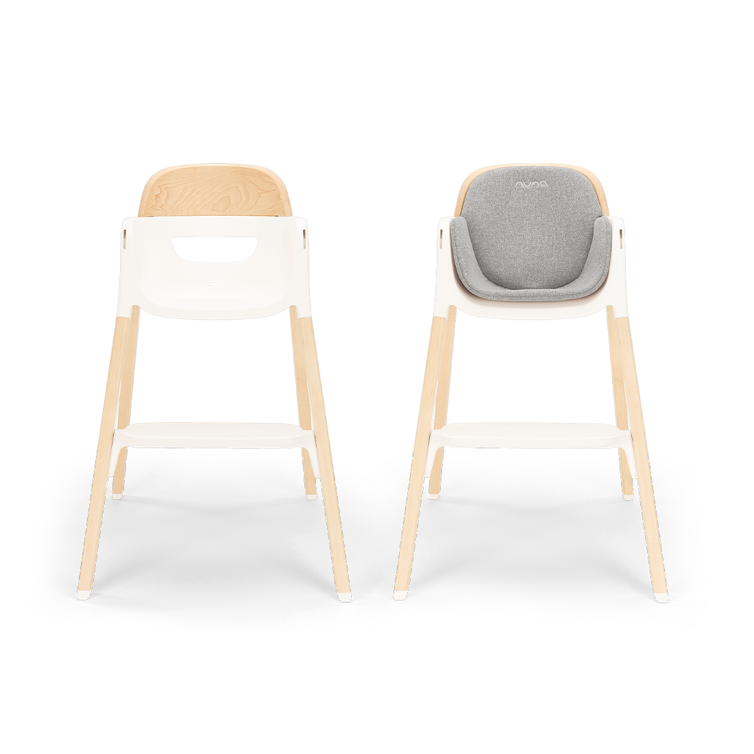 Nuna BRYN highchair with light wood legs white frame and beige upholstered seat in modern heritage design