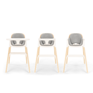 Three modern nuna bryn highchairs with light wood legs white plastic frames and gray upholstered seats in heritage style