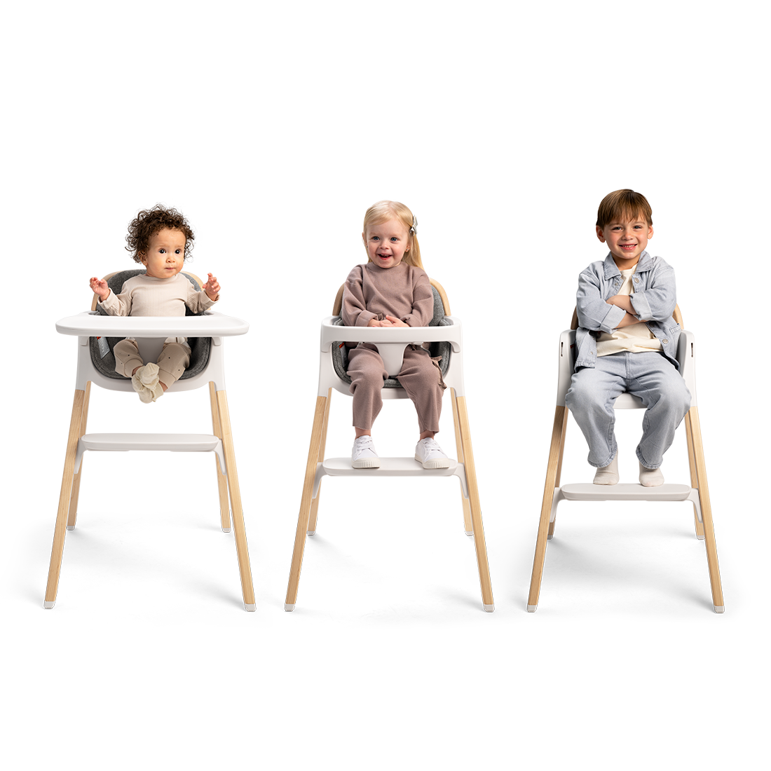 Nuna BRYN highchair in white and light wood with adjustable seating for toddlers in a modern design