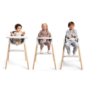Nuna BRYN highchair in white and light wood with adjustable seating for toddlers in a modern design