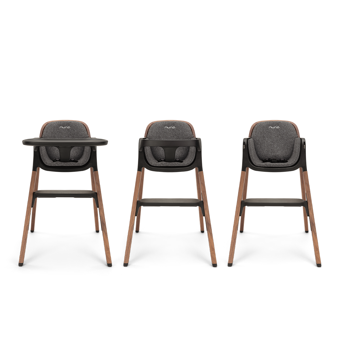 Three nuna bryn highchairs with dark gray upholstered seats and wooden legs for comfortable baby seating