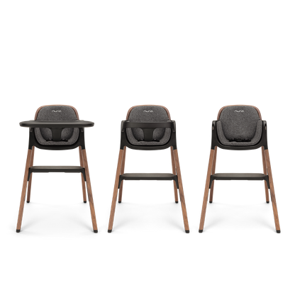 Three nuna bryn highchairs with dark gray upholstered seats and wooden legs for comfortable baby seating
