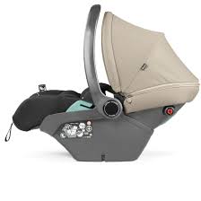 Beige and gray peg perego city loop pro infant car seat with soft fabric canopy and black padded side support