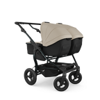 TFK Duo Twin & Sibling Sand Essential Twin Bundle – 2 Combi Units & Footmuffs | 2026 Combi Seat