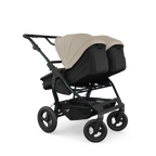 TFK Duo Twin & Sibling Sand Essential Twin Bundle – 2 Combi Units & Footmuffs | 2026 Combi Seat