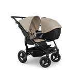 TFK Duo Twin & Sibling Sand Essential Twin Bundle – 2 Combi Units & Footmuffs | 2026 Combi Seat