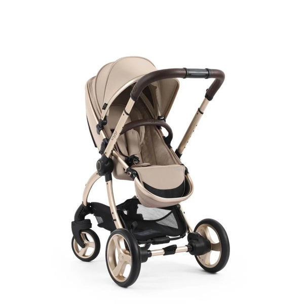 Beige and black egg3 feather all stages stroller with sleek modern design and metallic gold frame accents shown from back side