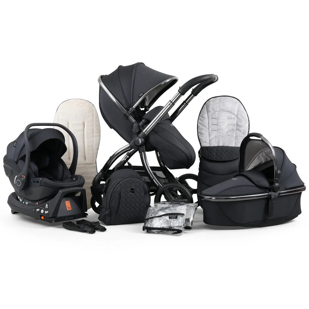 Black and silver stroller system with a matching car seat, bassinet, and carrycot