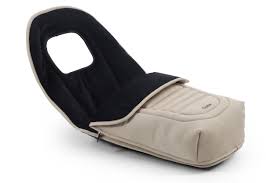 Beige and black infant sleeping bag with soft padded design included in oyster 4 buttermilk luxury travel system