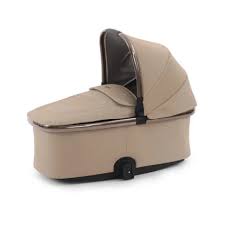 Beige convertible bassinet with soft fabric and black trim in oyster 4 fawn essentials travel system with car seat